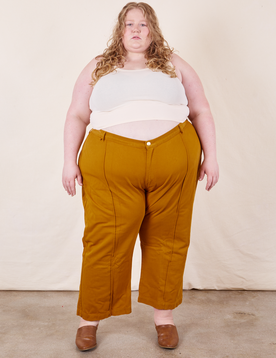 Western Pants in Spicy Mustard on Catie wearing vintage off-white Tank Top