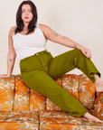 Faye is wearing Work Pants in Olive Green and vintage off-white Tank Top