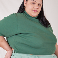 Sarita is wearing size 2XL 1/2 Sleeve Essential Turtleneck in Dark Emerald Green