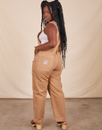 Back view of Original Overalls in Tan worn by Shai