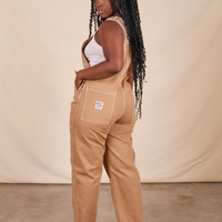 Back view of Original Overalls in Tan worn by Shai