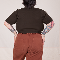 Back view of Sam wearing 1/2 Sleeve Essential Turtleneck in Espresso Brown and fudgesicle brown Bell Bottoms