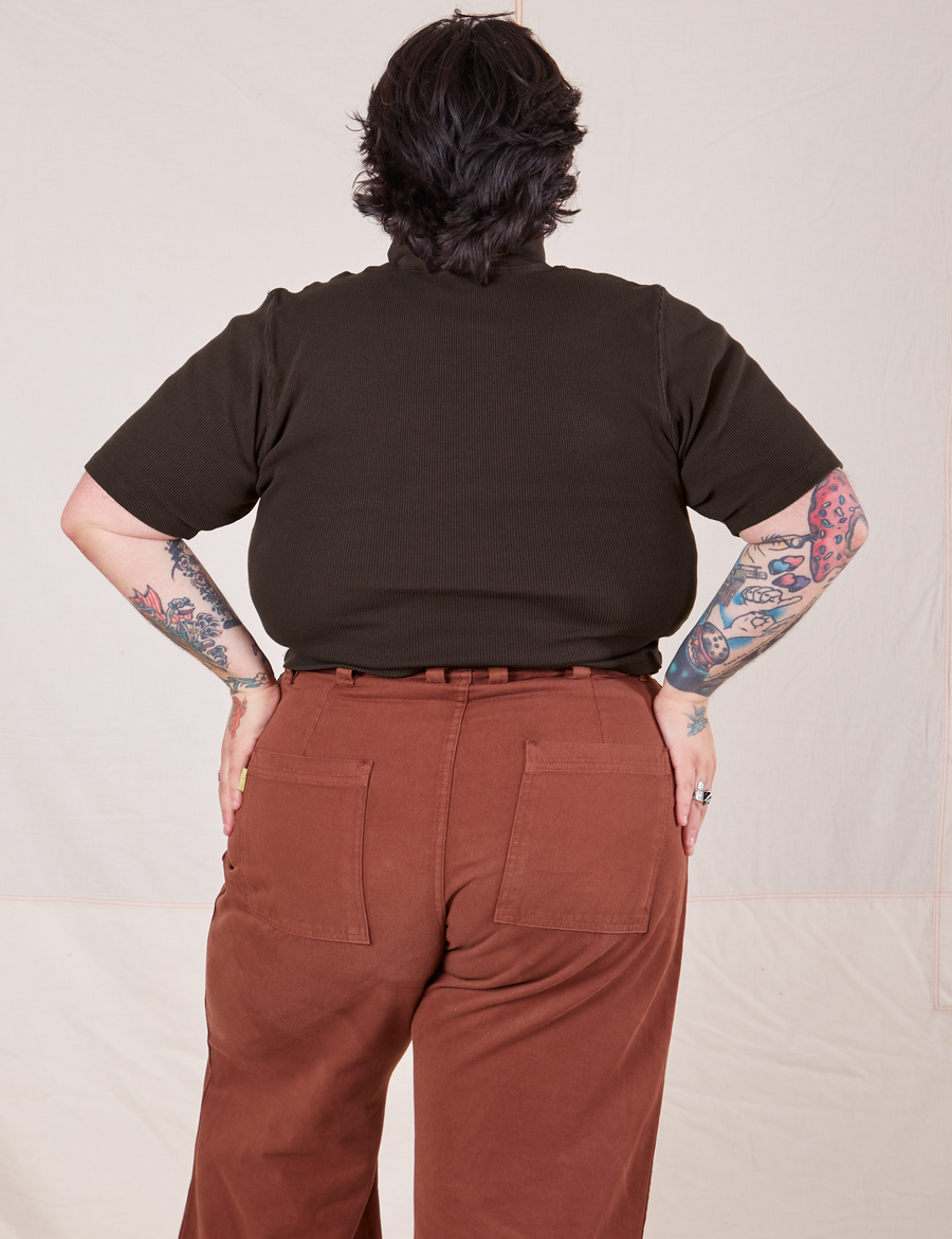 Back view of Sam wearing 1/2 Sleeve Essential Turtleneck in Espresso Brown and fudgesicle brown Bell Bottoms