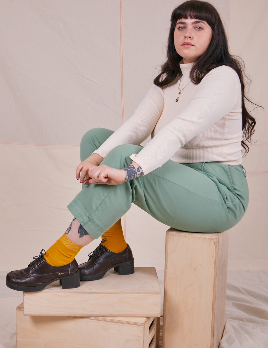 Sydney is wearing Essential Turtleneck in Vintage Off-White