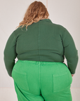 Back view of Long Sleeve Fisherman Polo in Dark Emerald Green worn by Catie