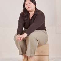 Long Sleeve Fisherman Polo in Espresso Brown on Ashley wearing khaki grey Western Pants sitting on wooden crate