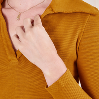 Long Sleeve Fisherman Polo in Spicy Mustard front close up on Alex