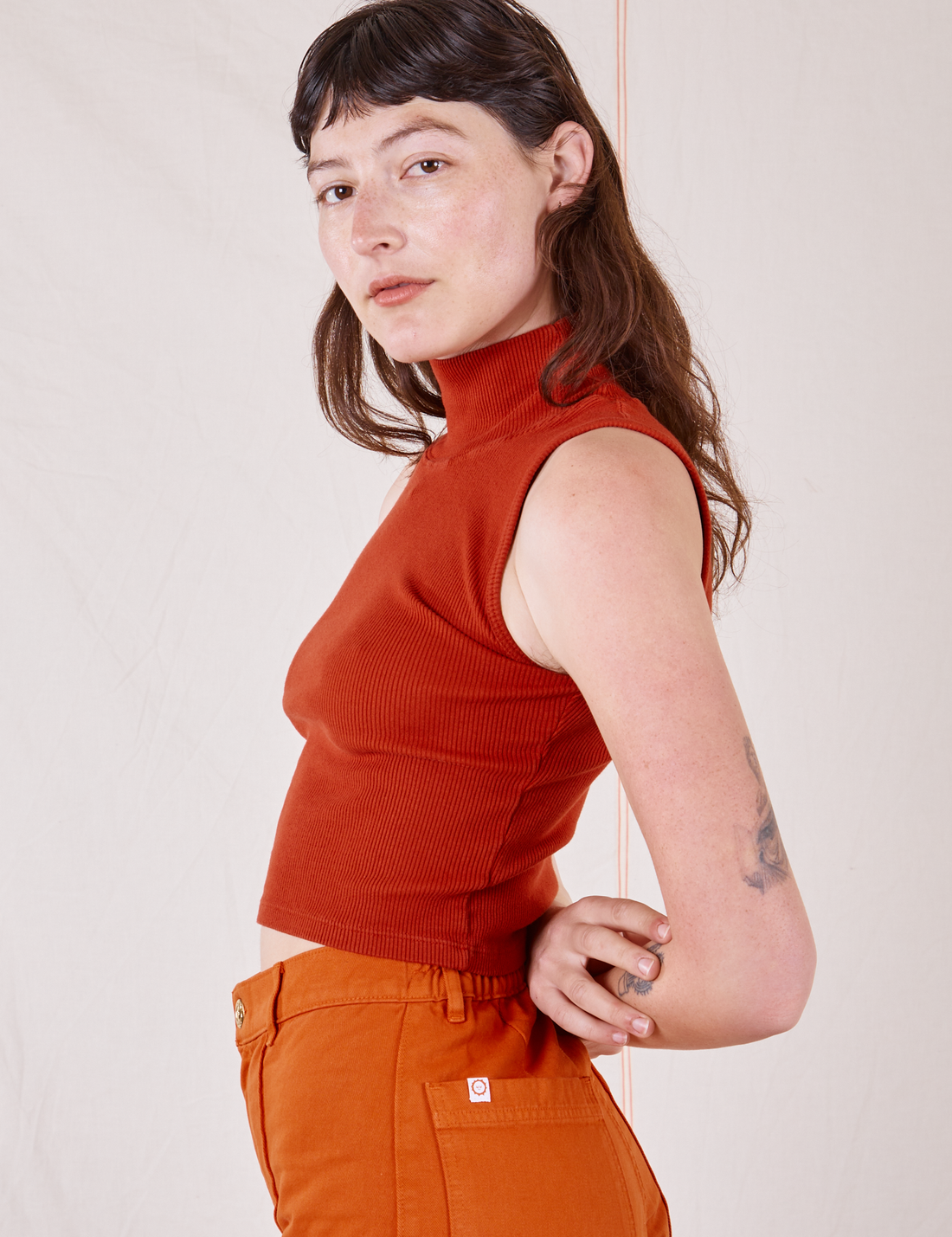 Sleeveless Essential Turtleneck in Paprika side view on Alex