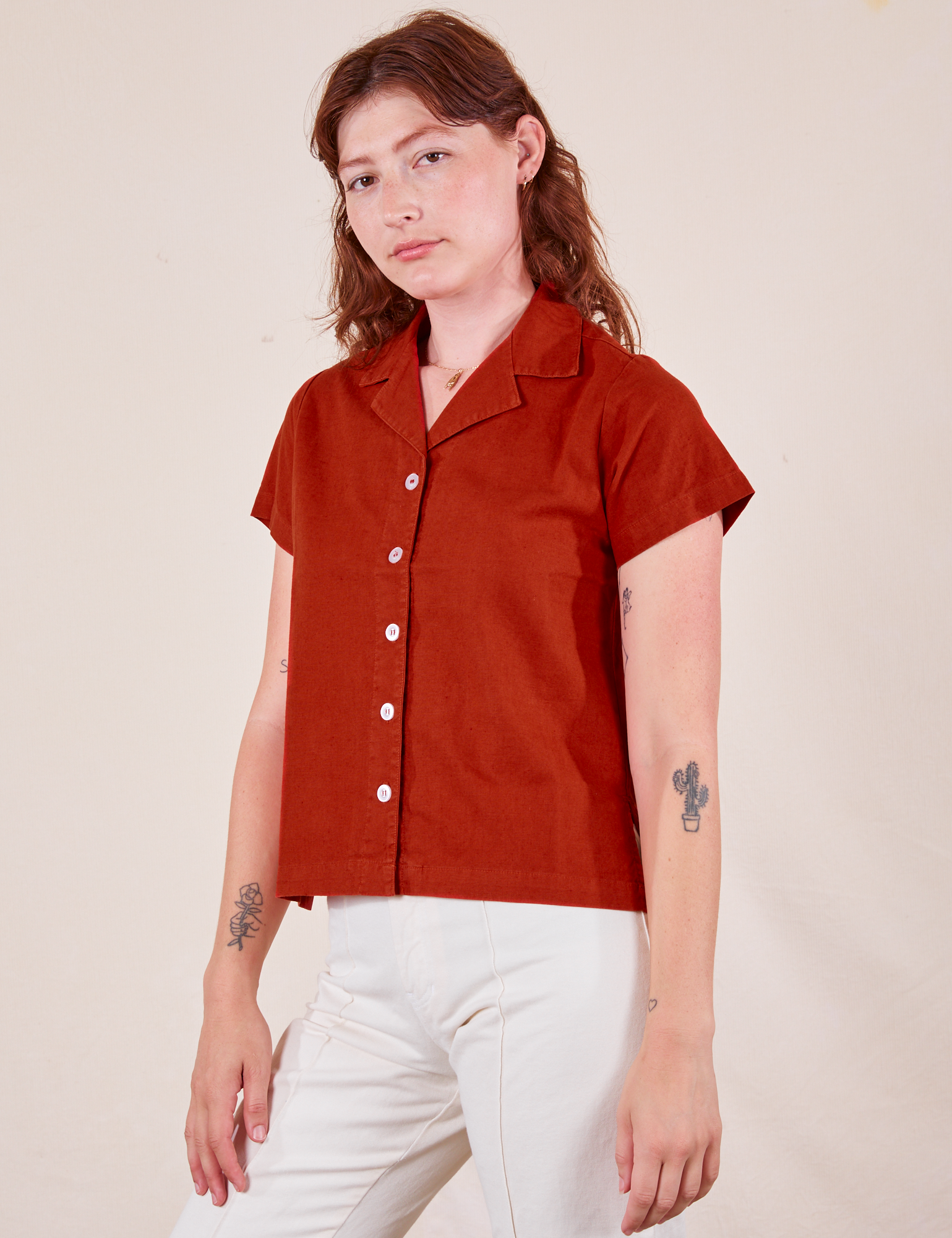 Alex is wearing Pantry Button-Up in Paprika