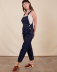 Alex is 5'8"and wearing P Original Overalls in Navy Blue