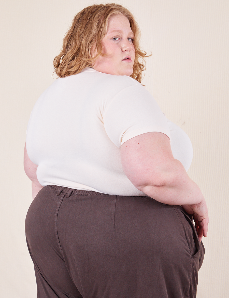 Angled back view of Baby Tee in Vintage Tee White on Catie