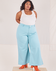 Morgan is wearing Bell Bottoms in Baby Blue and vintage off-white Tank Top