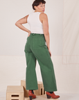 Back view of Bell Bottoms in Dark Emerald Green and vintage off-white Tank Top worn by Tiara