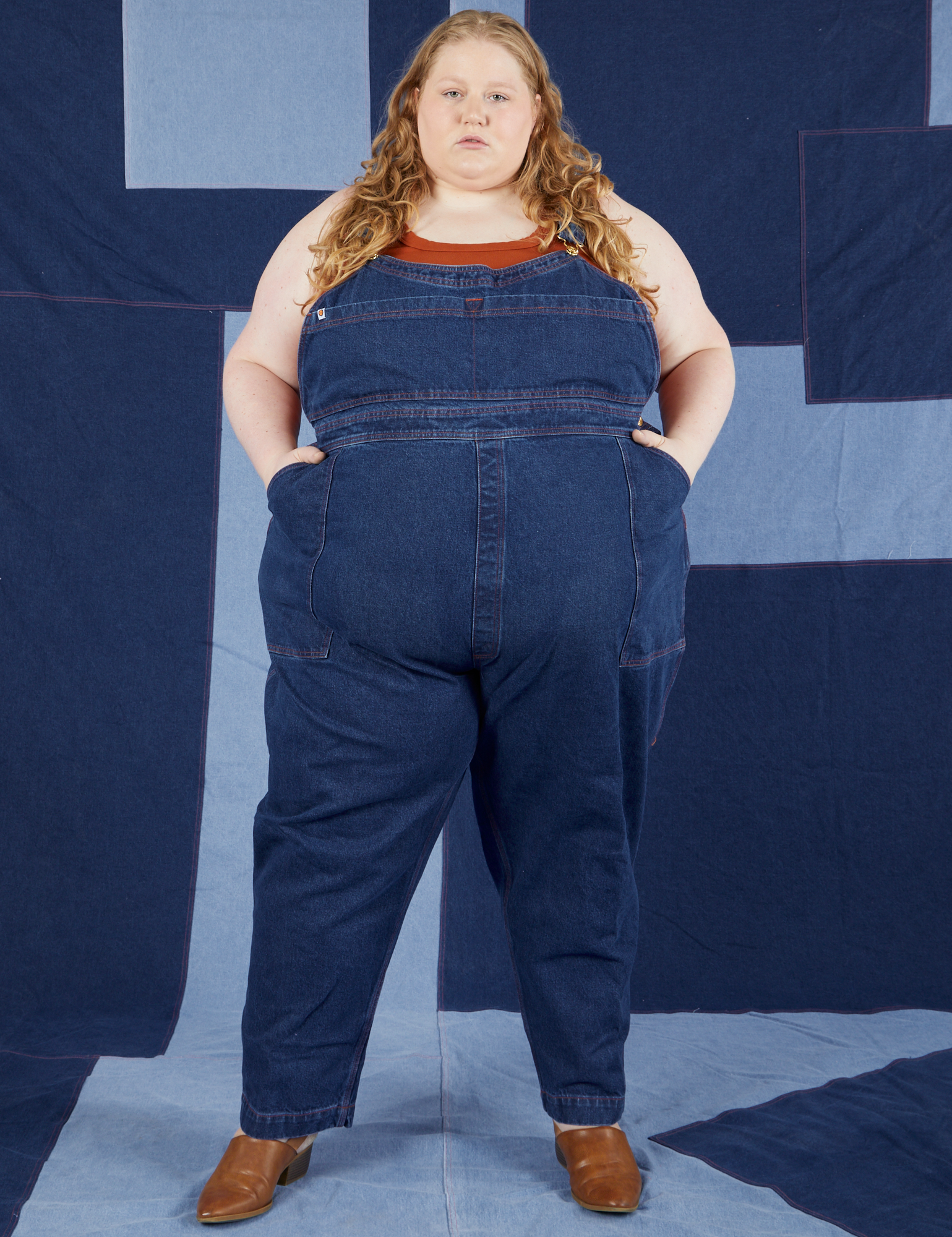 Indigo Denim Original Overalls in Dark Wash on Catie wearing burnt terracotta Tank Top