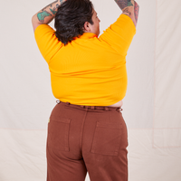 1/2 Sleeve Essential Turtleneck in Sunshine Yellow back view on Sam wearing fudgesicle brown Bell Bottoms