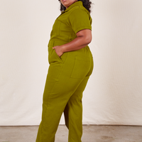 Side view of Short Sleeve Jumpsuit in Olive Green worn by Morgan