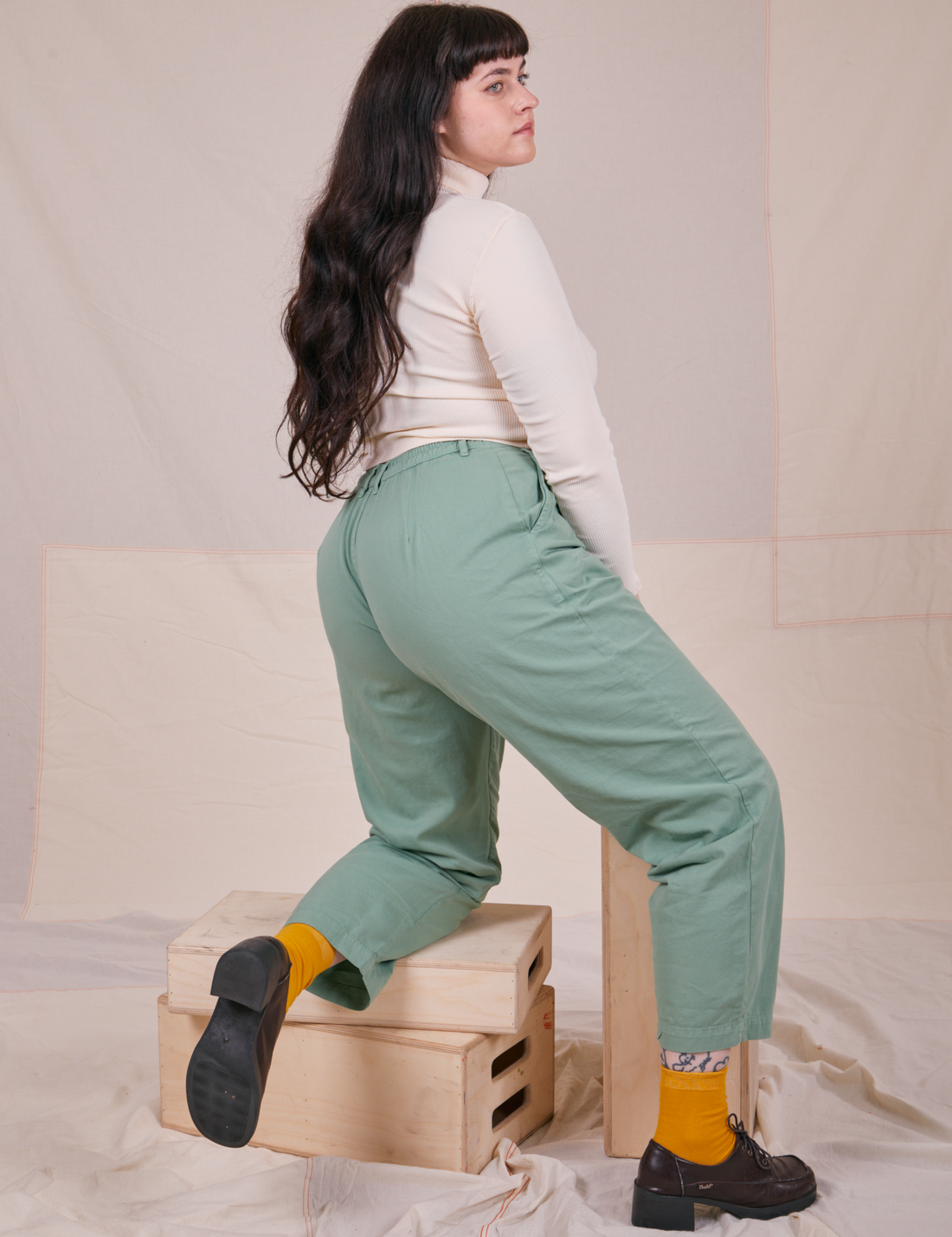 Side view of Essential Turtleneck in Vintage Off-White worn by Sydney