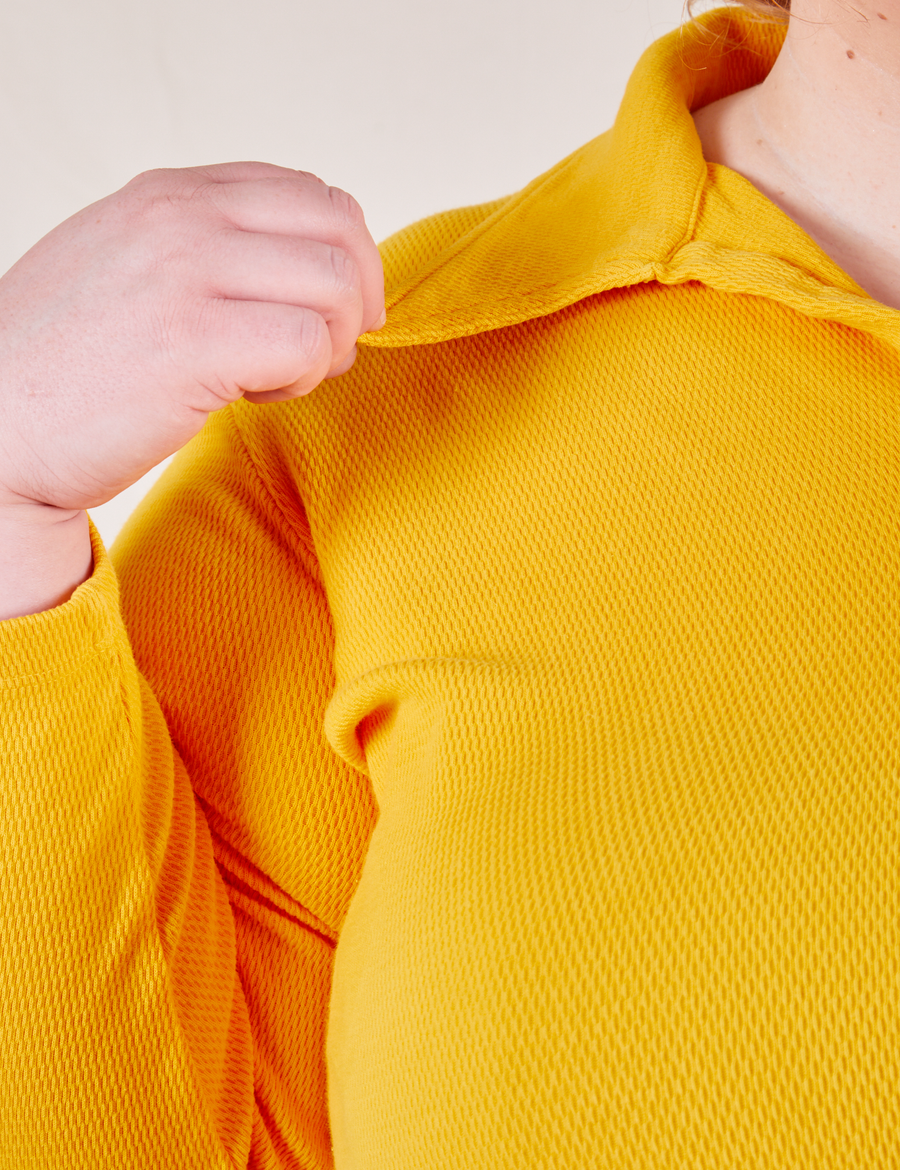 Long Sleeve Fisherman Polo in Sunshine Yellow front close up on Catie