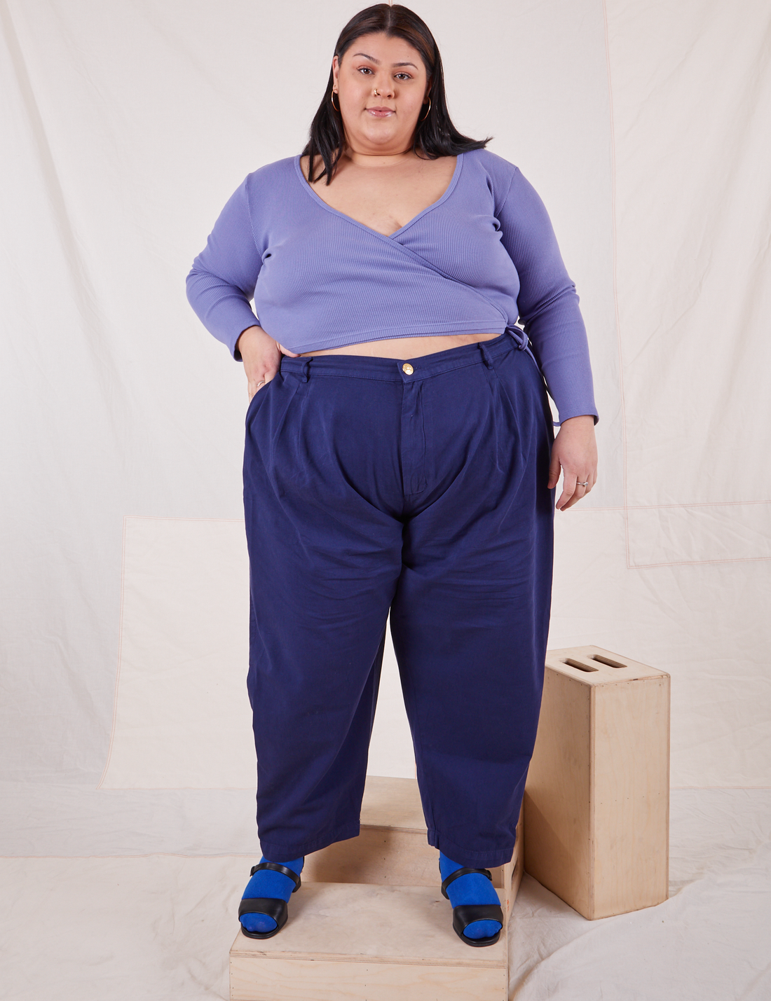 Wrap Top in Faded Grape on Sarita wearing Navy Blue Trousers