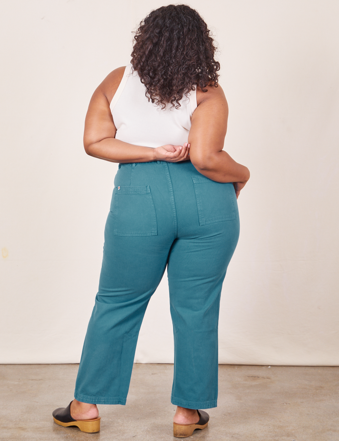 Work Pants in Marine Blue back view on Morgan wearing vintage off-white Tank Top