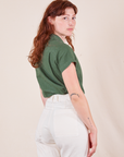 Angled back view of Pantry Button-Up in Dark Emerald Green