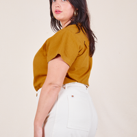 Pantry Button-Up in Spicy Mustard side view on Faye wearing vintage off-white Western Pants