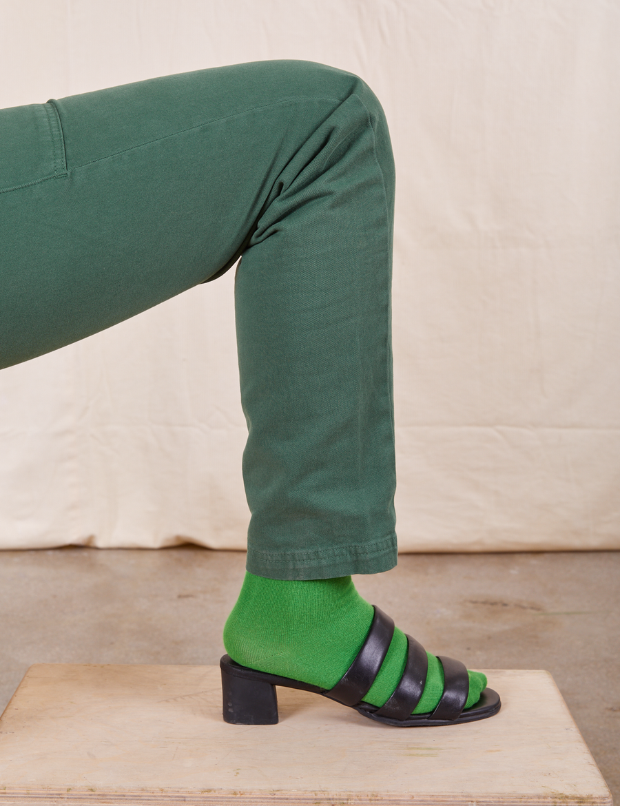 Pencil Pants in Dark Emerald Green leg close up wearing Everyday Sock in kelly green