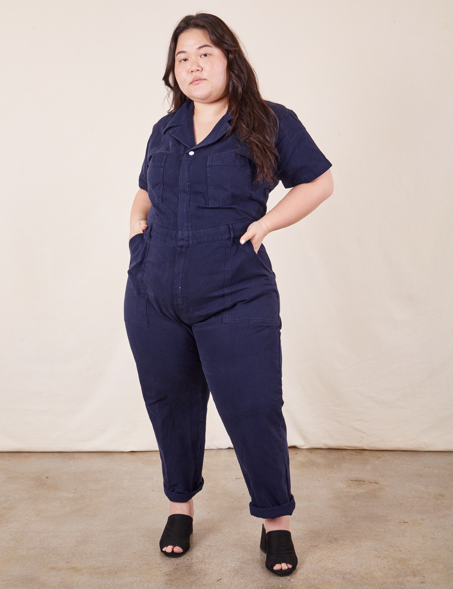 Ashley is 5&#39;7&quot; and wearing 1XL Short Sleeve Jumpsuit in Navy Blue