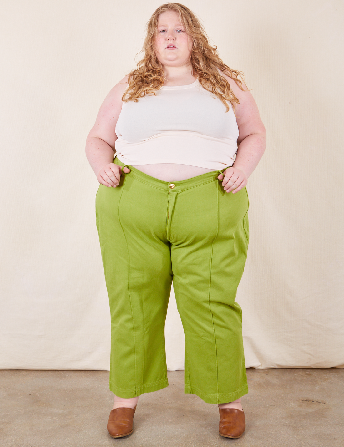 Western Pants in Gross Green on Catie wearing vintage off-white Tank Top