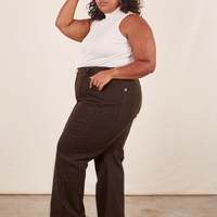 Side view of Western Pants in Espresso Brown paired with a vintage off-white Sleeveless Essential worn by Morgan