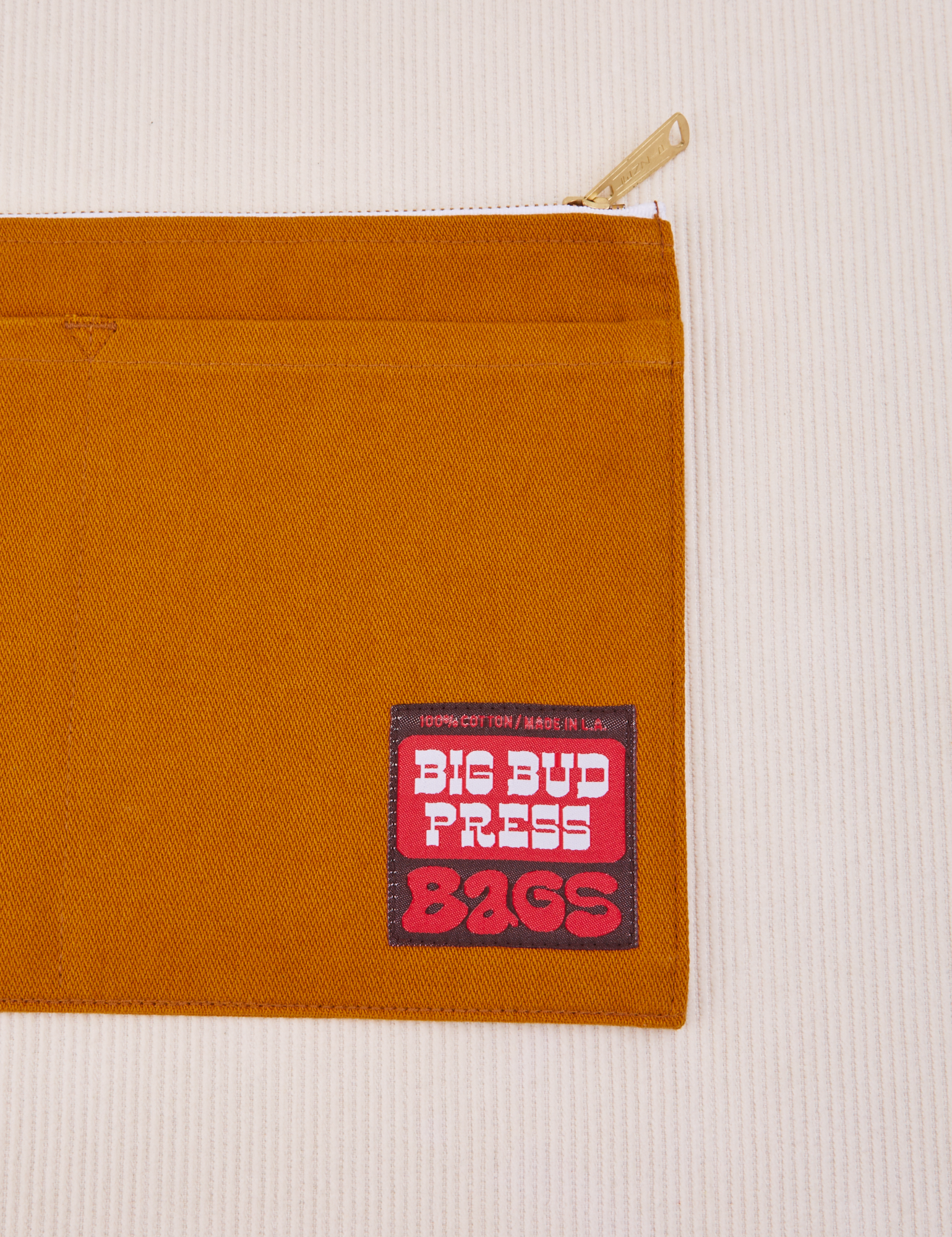 Big Pouch in Spicy Mustard with big bud press label in red and brown