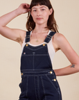 Alex is wearing Original Overalls in Navy Blue and vintage off-white Tank Top