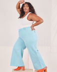 Side view of Bell Bottoms in Baby Blue and vintage off-white Tank Top worn by Tiara