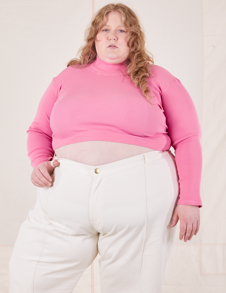 Catie is wearing 3XL Essential Turtleneck in Bubblegum Pink paired with vintage off-white Western Pants