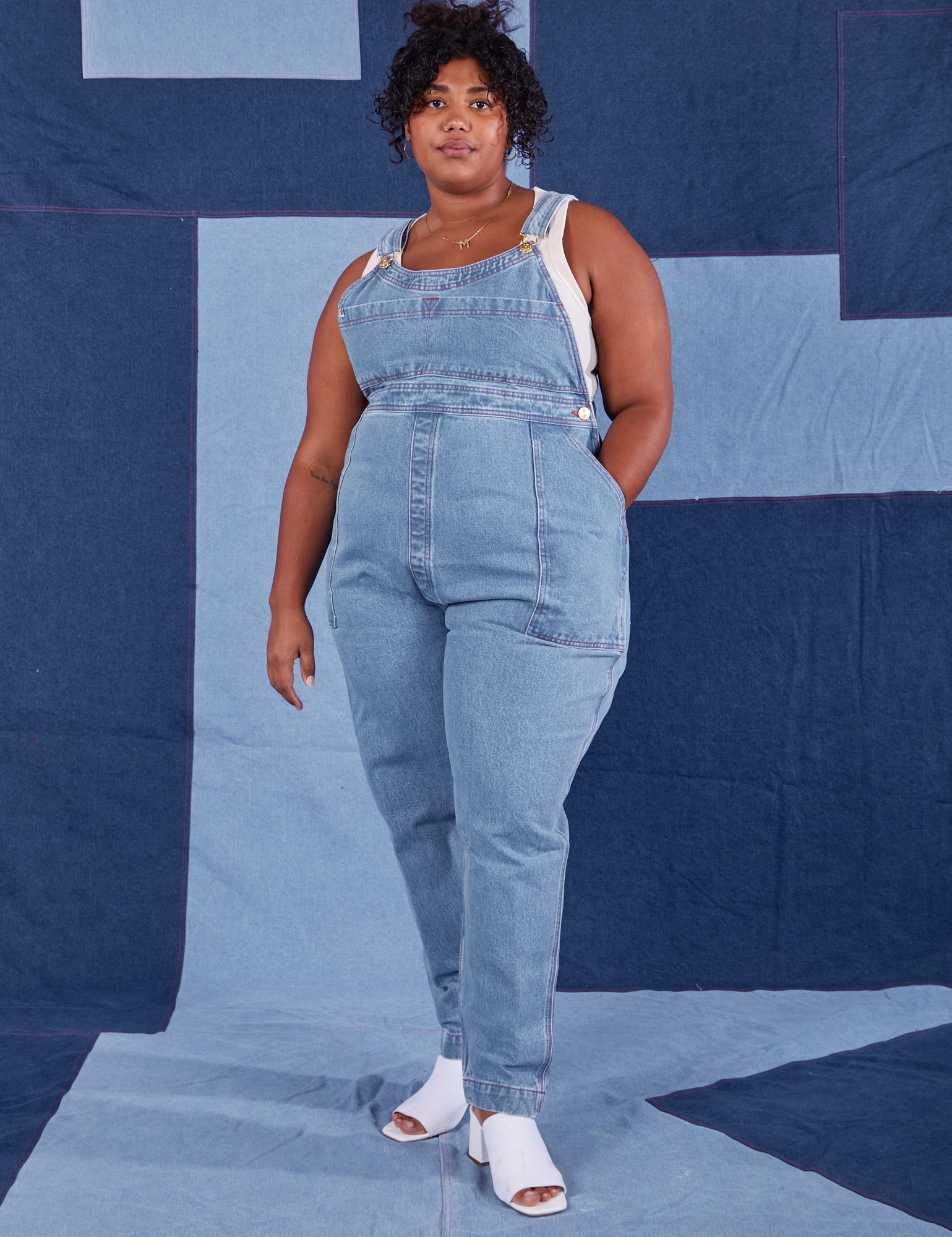 Morgan is 5&#39;5&quot; and wearing 1XL Indigo Denim Original Overalls in Light Wash