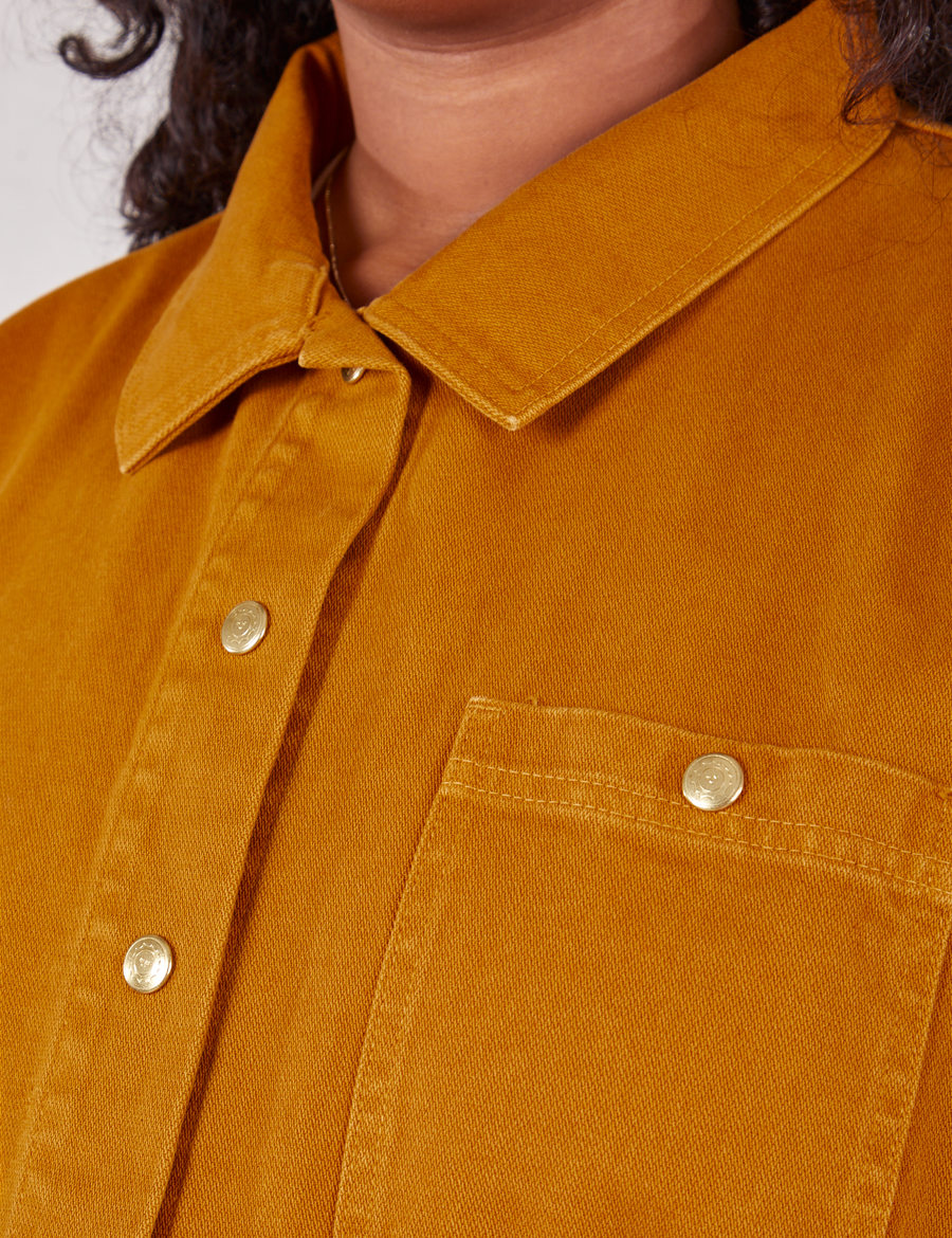 Denim Work Jacket in Spicy Mustard front close up showing custom baby sun brass buttons