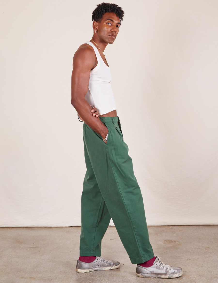 Side view of Heavyweight Trousers in Dark Emerald Green worn by Jerrod