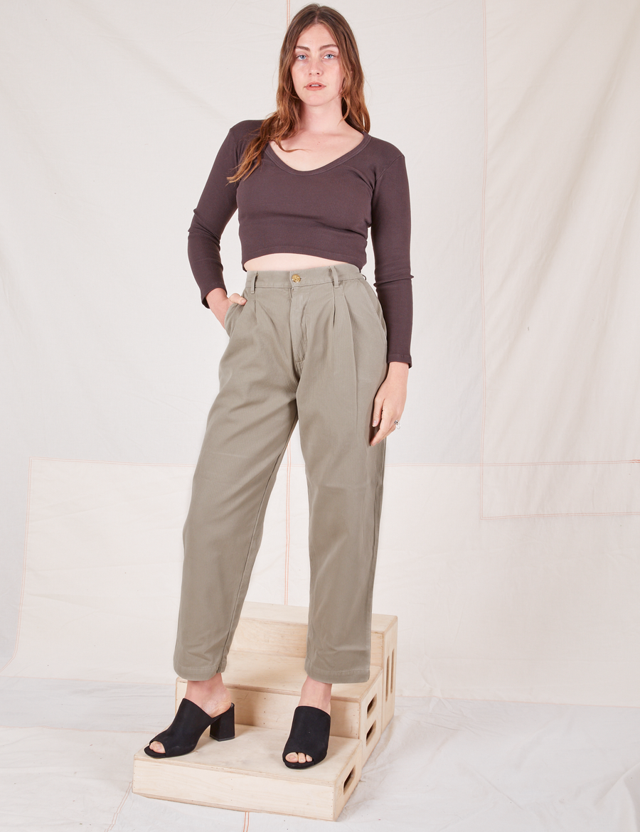Allison is 5'10" and wearing S Heritage Trousers in Khaki Grey paired with espresso brown Long Sleeve V-Neck Tee