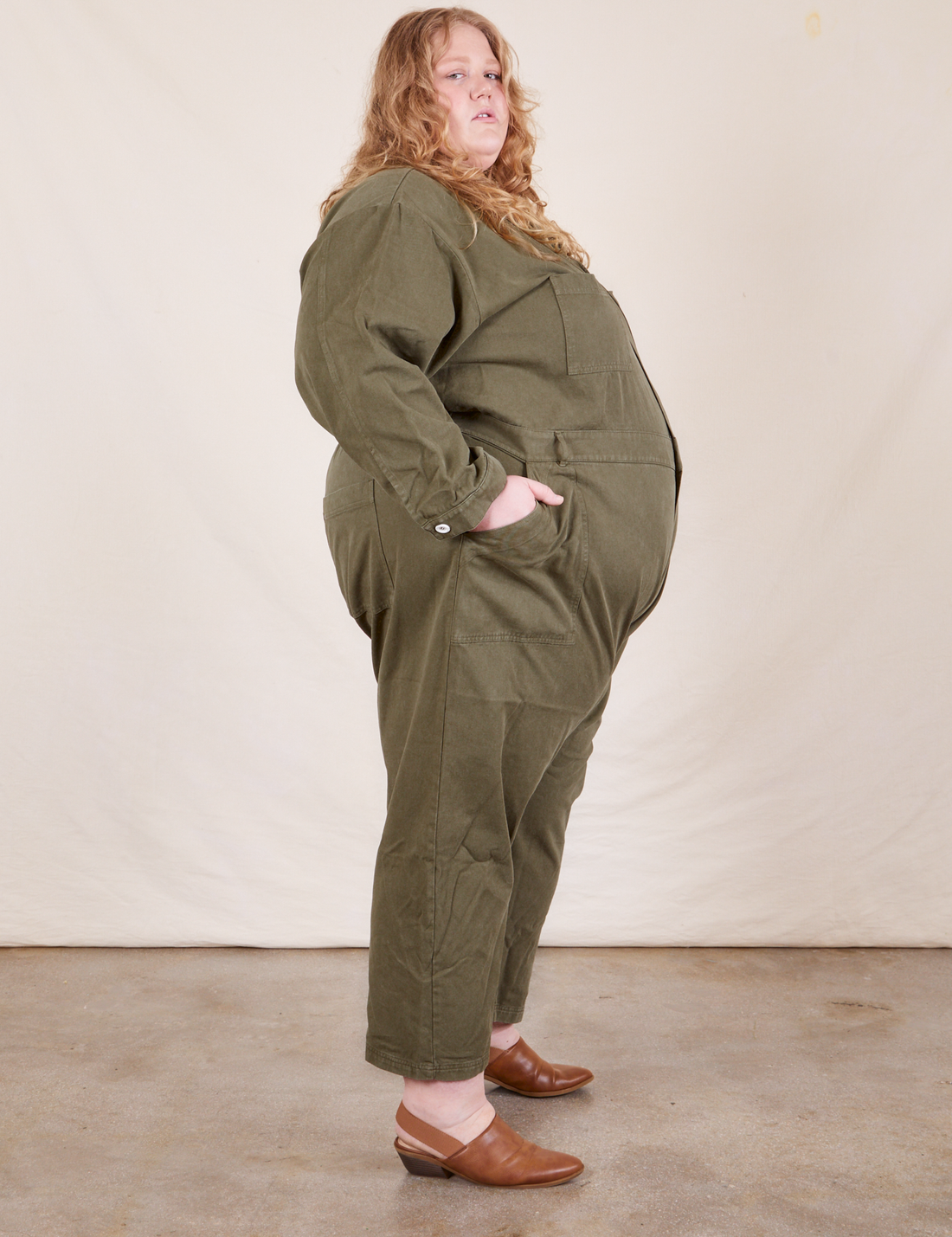 Side view of Everyday Jumpsuit in Surplus Green worn by Catie