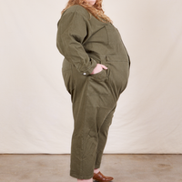 Side view of Everyday Jumpsuit in Surplus Green worn by Catie