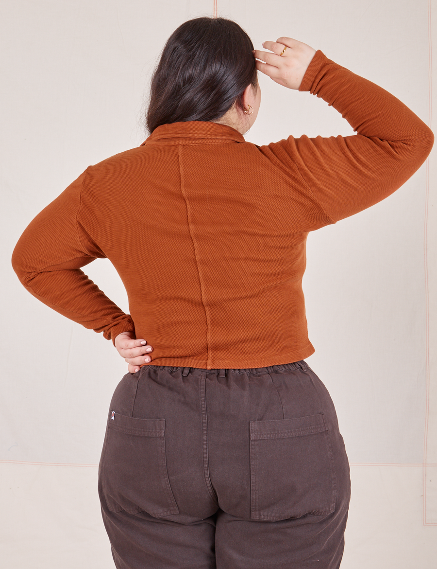 Back view of Long Sleeve Fisherman Polo in Burnt Terracotta worn by Ashley