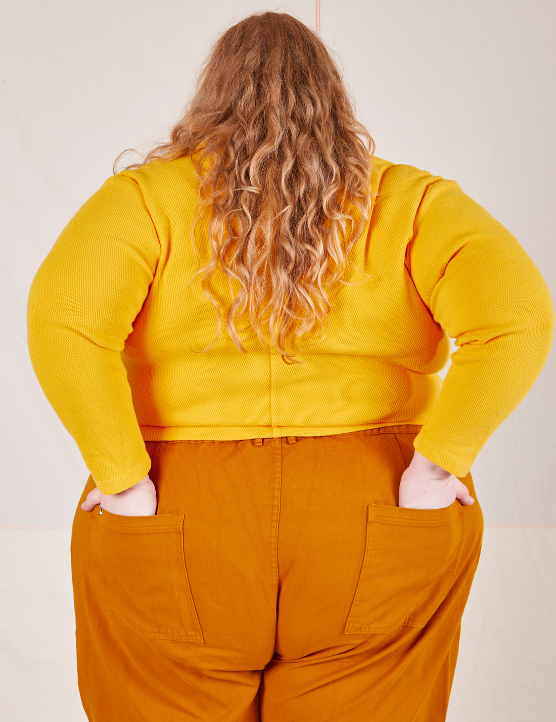 Long Sleeve Fisherman Polo in Sunshine Yellow back view on Catie wearing spicy mustard Western Pants