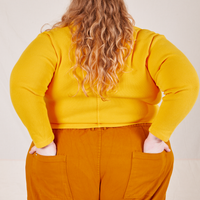 Long Sleeve Fisherman Polo in Sunshine Yellow back view on Catie wearing spicy mustard Western Pants