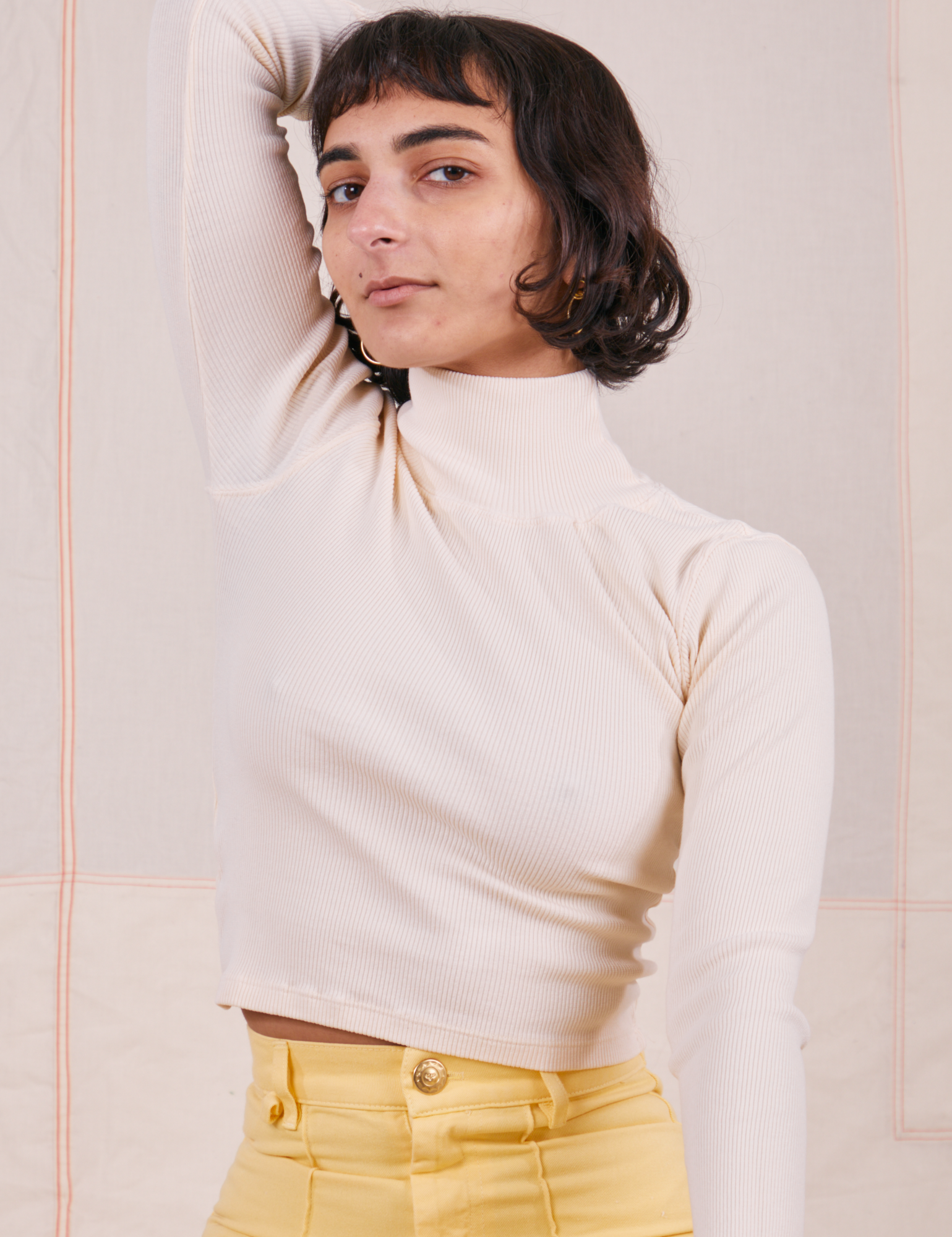 Soraya is wearing P Essential Turtleneck in Vintage Off-White