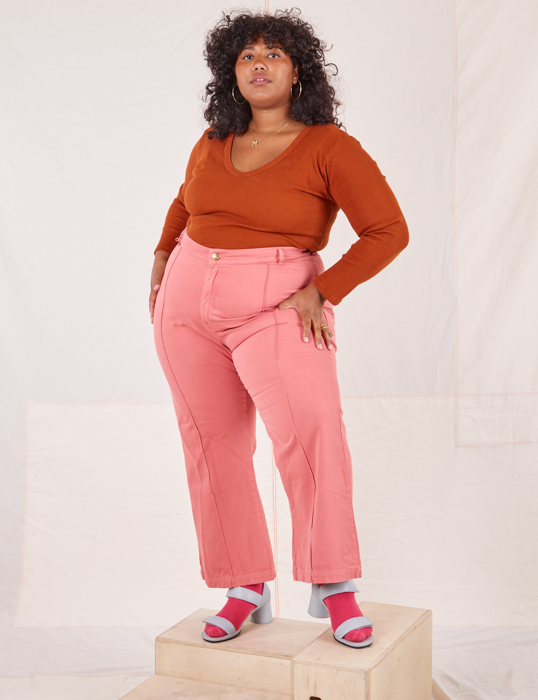 Morgan is wearing Long Sleeve V-Neck Tee in Burnt Terracotta