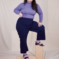 Ashley is wearing Essential Turtleneck in Faded Grape and navy Western Pants