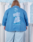 Neoclassical Work Jacket in Blue Venus back view on Catie wearing baby blue Bell Bottoms