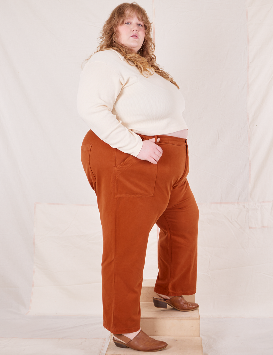 Organic Work Pants in Burnt Terracotta side view on Catie wearing vintage off-white Long Sleeve Fisherman Polo