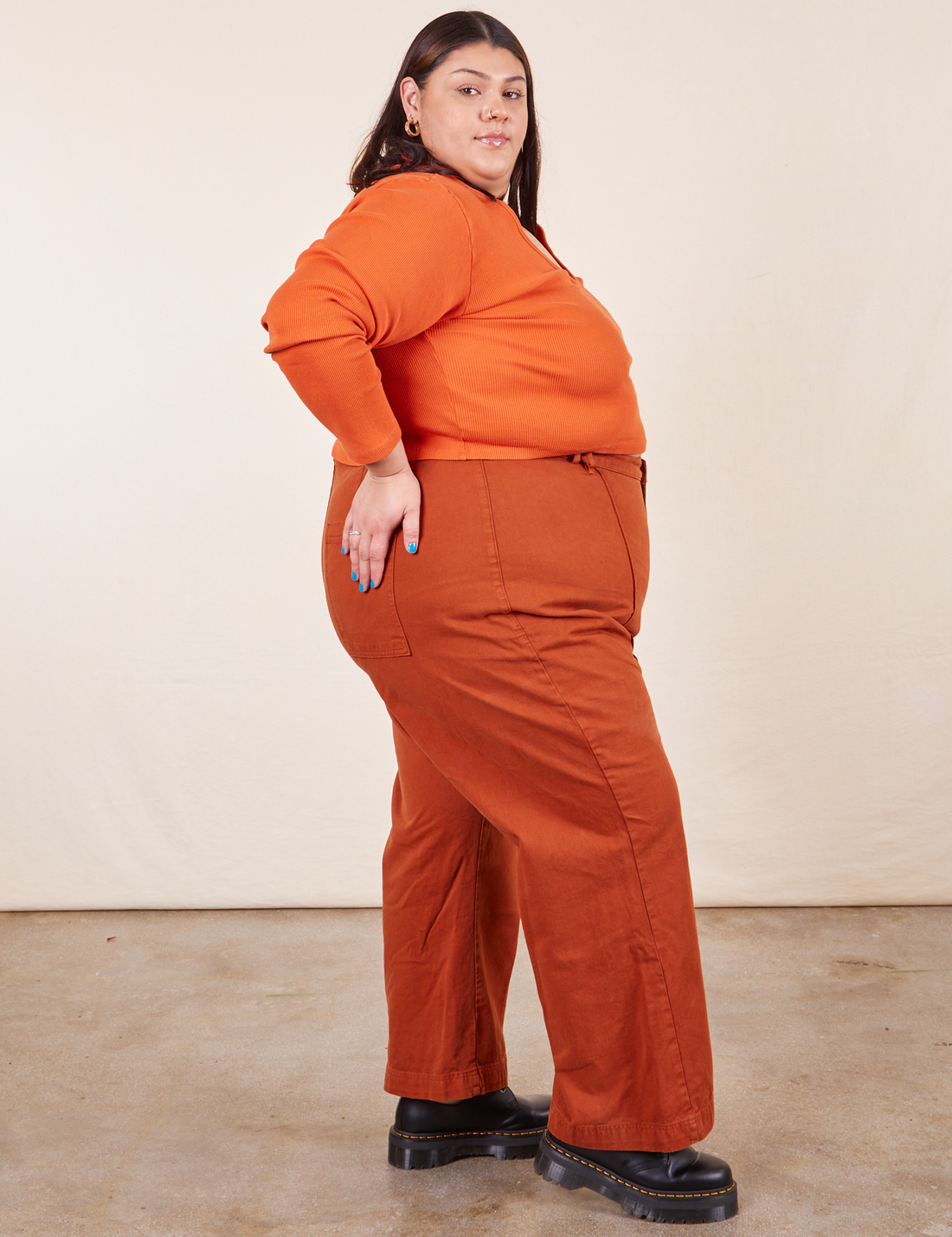 Western Pants in Burnt Terracotta side view on Sarita wearing burnt orange Long Sleeve V-Neck