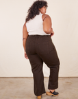 Back view of Western Pants in Espresso Brown paired with a vintage off-white Sleeveless Turtleneck worn by Morgan